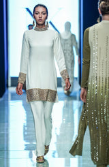 White Kundun shirt and bootcut pants