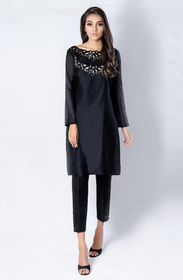 Black tunic with cutwork neckline.